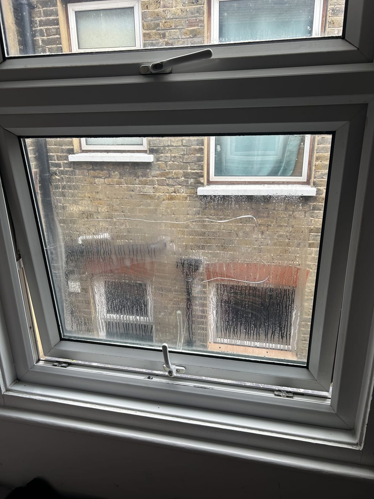 Misted unit swapped, frame kept — before, Surrey